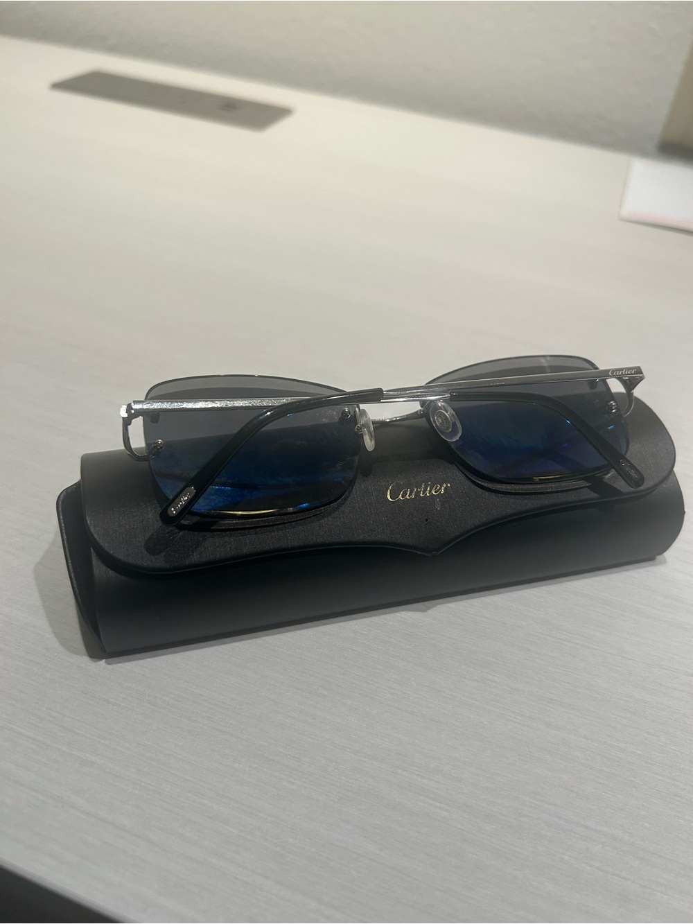 Cartier Men's Silver Frame Sunglasses with Blue Lenses